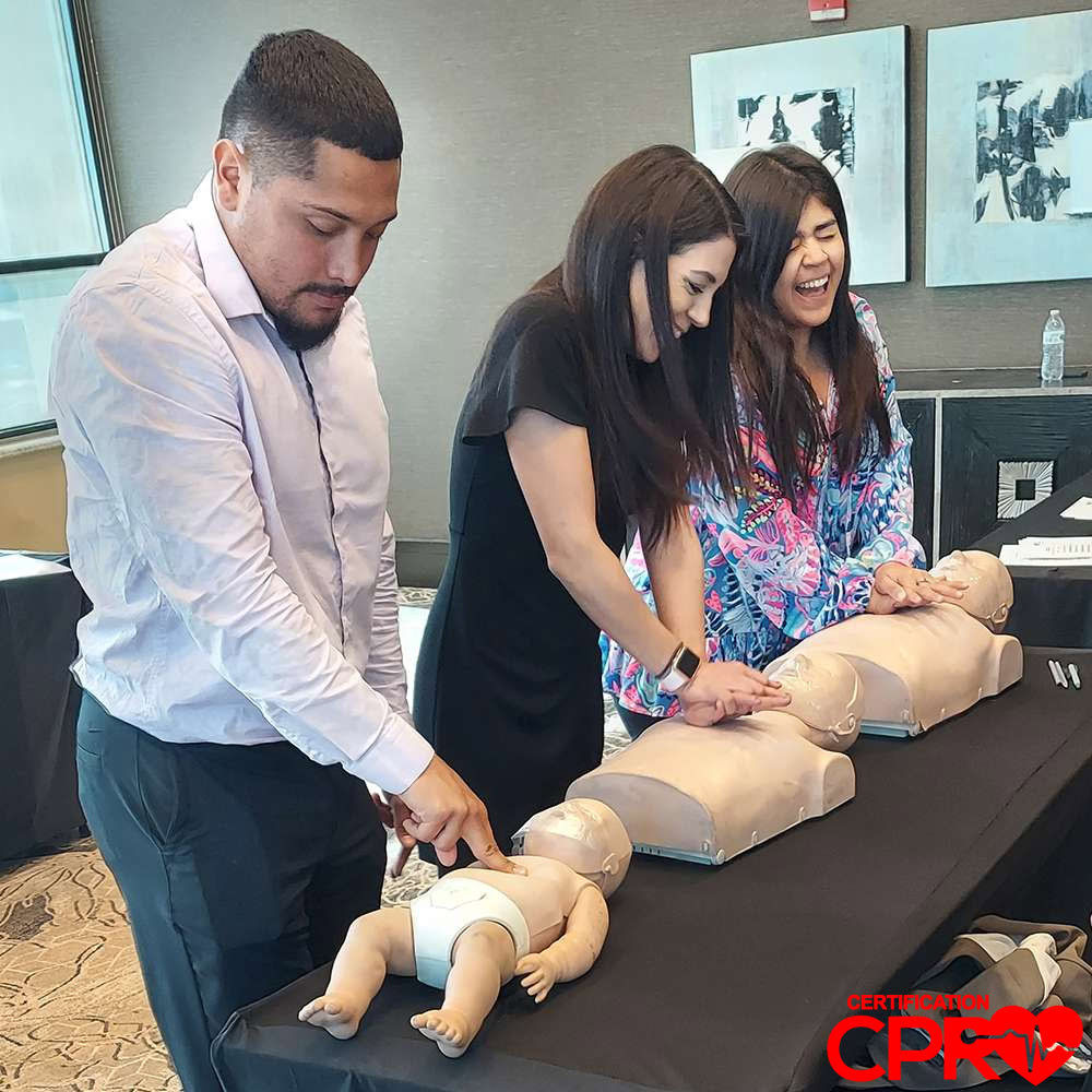 CPR training class in Jacksonville with students practicing on mannequins.